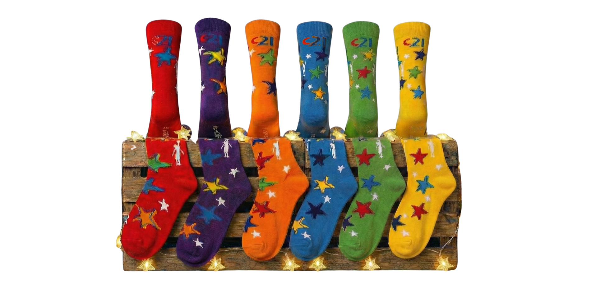 different coloured socks with stars placed on a crate in a line