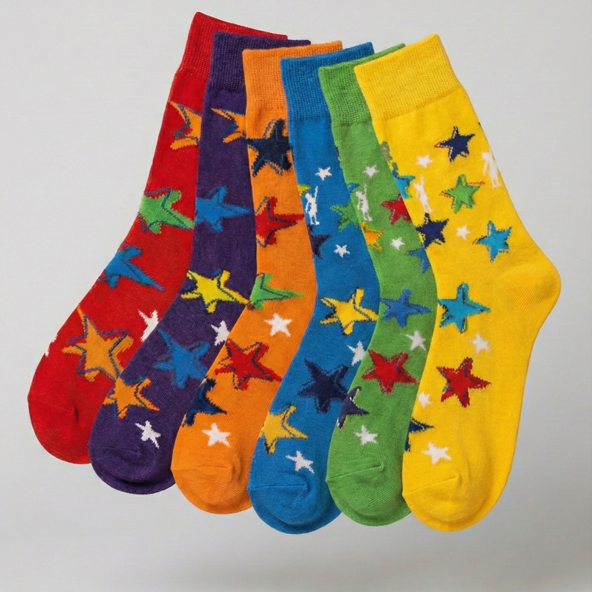 Five colorful socks with star patterns on a light gray background